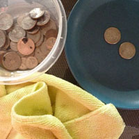 Washing Coins in the Water Table - preschool fine motor activity